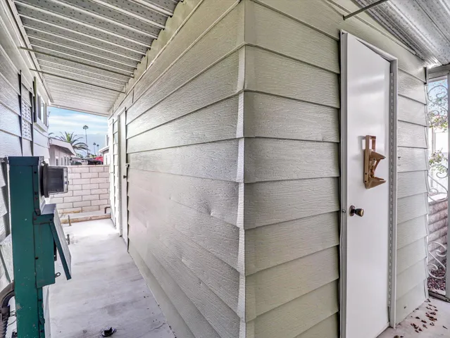 a view of a house with a backyard and a patio