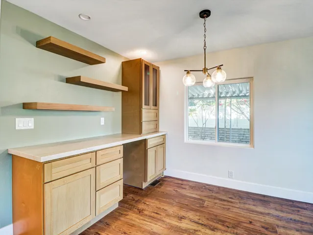 a kitchen with stainless steel appliances white cabinets and a sink