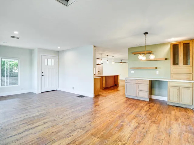 a kitchen with stainless steel appliances granite countertop a stove and a microwave