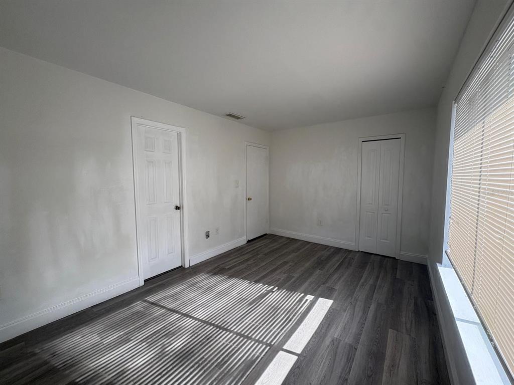 4033 Henley Road, Unit 1707 Orlando, FL 32839 - Photo 53 of 66 a view of wooden floor in a room