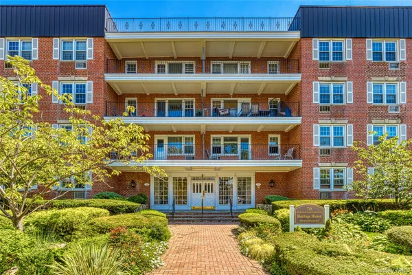 a front view of a multi story residential apartment building