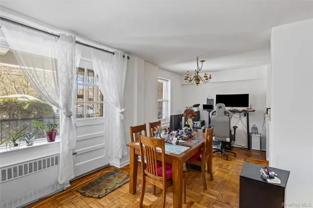 a view of a dining room with furniture window and wooden floor