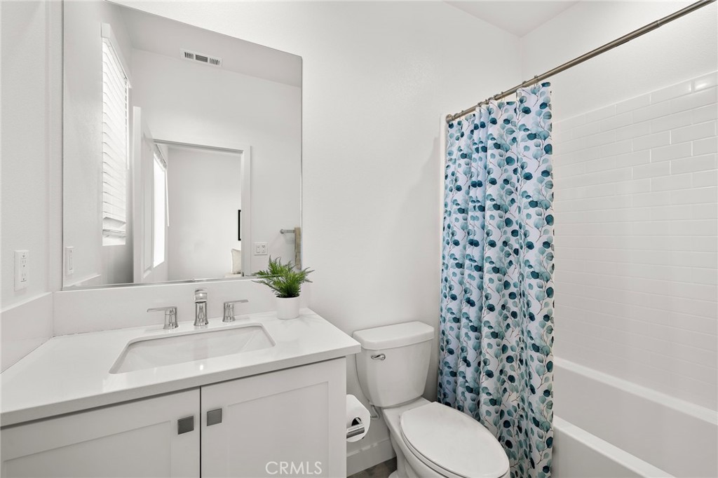 61 Wheelbarrow Road Rancho Mission Viejo, CA 92694 - Photo 21 of 74 a bathroom with a sink toilet and shower