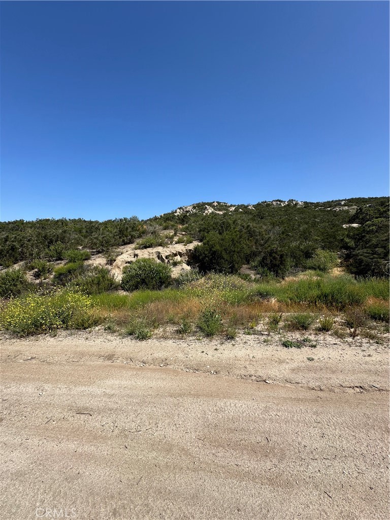 66 Rocky Knoll Road Hemet, CA 92544 - Photo 2 of 11 a view of a lake with a mountain