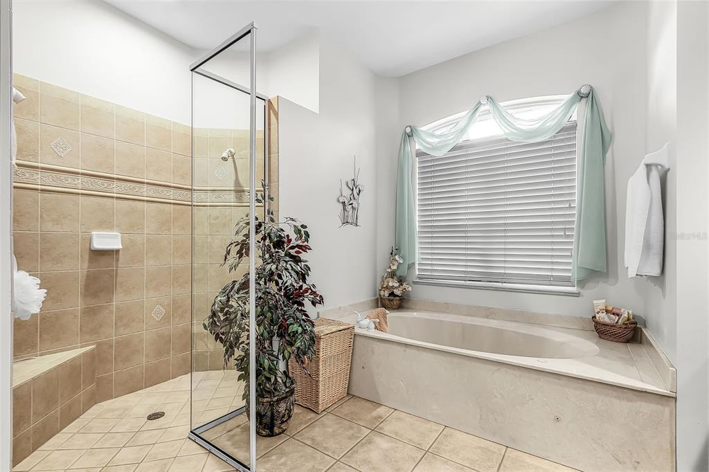 400 Gun Cay Lane Punta Gorda, FL 33950 - Photo 19 of 50 a bathroom with a bathtub and a shower