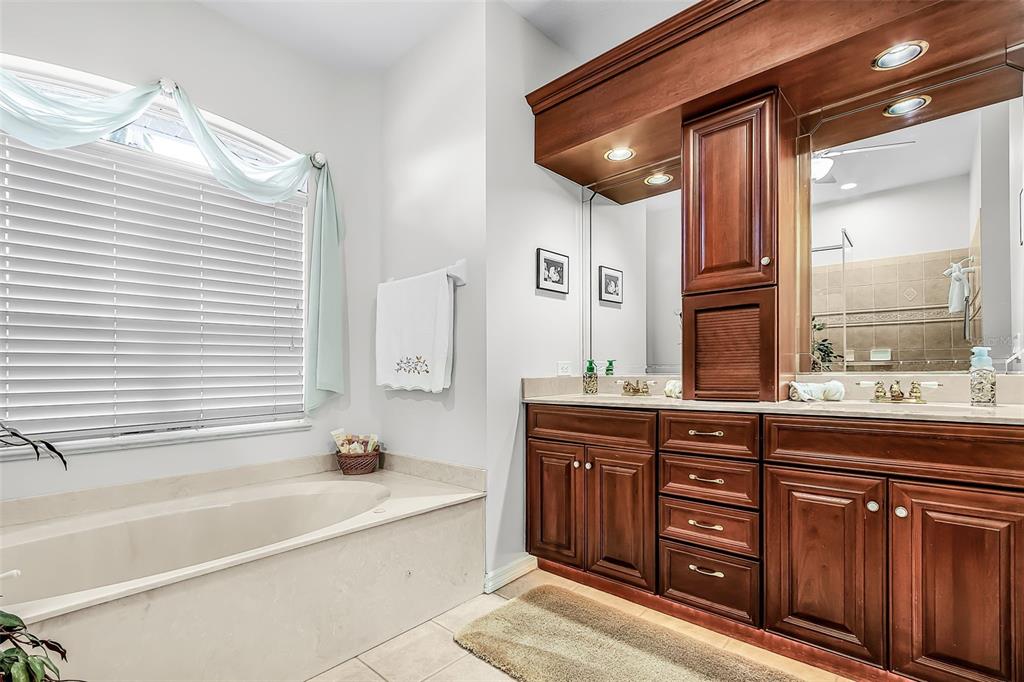 400 Gun Cay Lane Punta Gorda, FL 33950 - Photo 20 of 50 a spacious bathroom with a tub sink and mirror