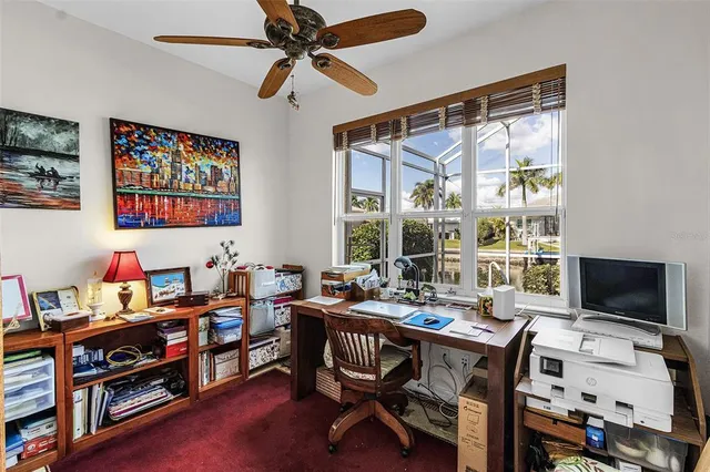 a view of a livingroom with furniture and a dining table