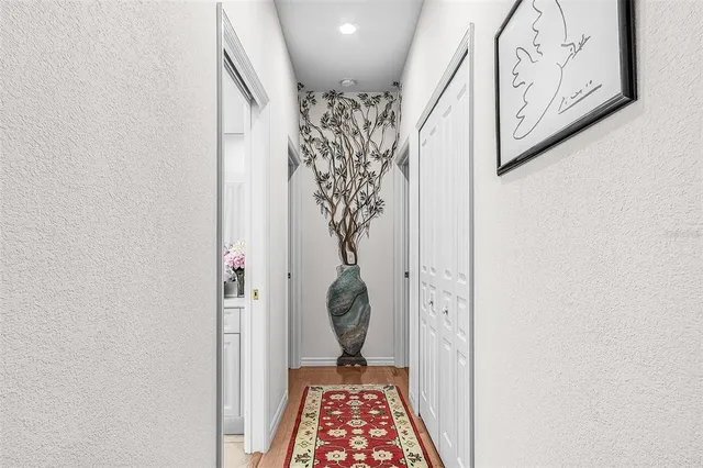 a view of a kitchen with a dining table and chairs