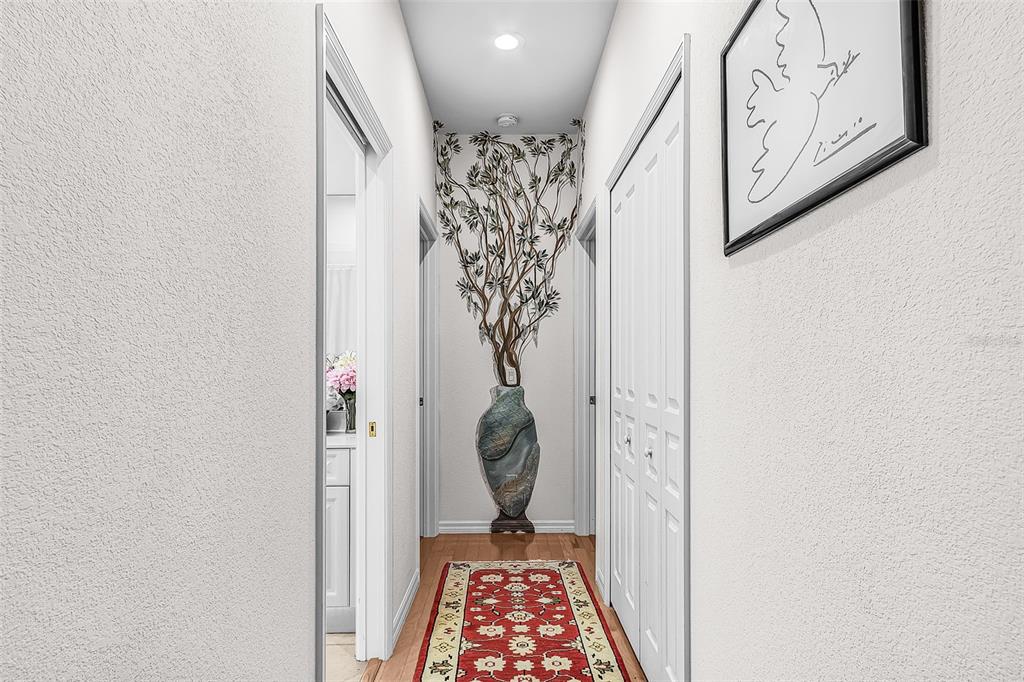 400 Gun Cay Lane Punta Gorda, FL 33950 - Photo 23 of 50 a view of a hallway with paintings on the wall