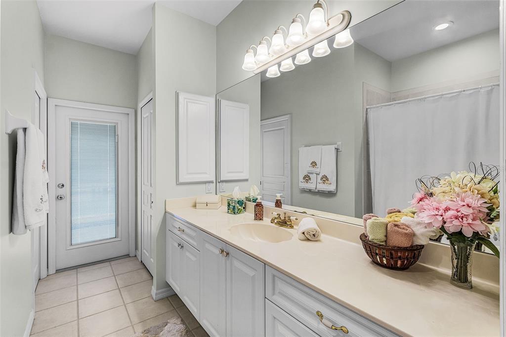 400 Gun Cay Lane Punta Gorda, FL 33950 - Photo 26 of 50 a spacious en suite bathroom with a double vanity sink and a mirror