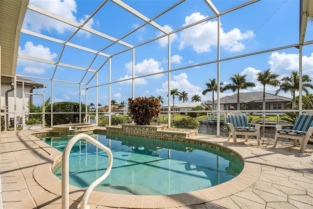 400 Gun Cay Lane Punta Gorda, FL 33950 - Photo 32 of 50 a view of a swimming pool with a patio