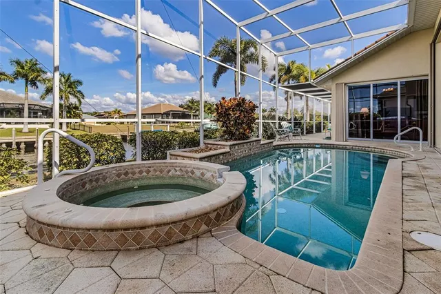 an aerial view of a house with a swimming pool