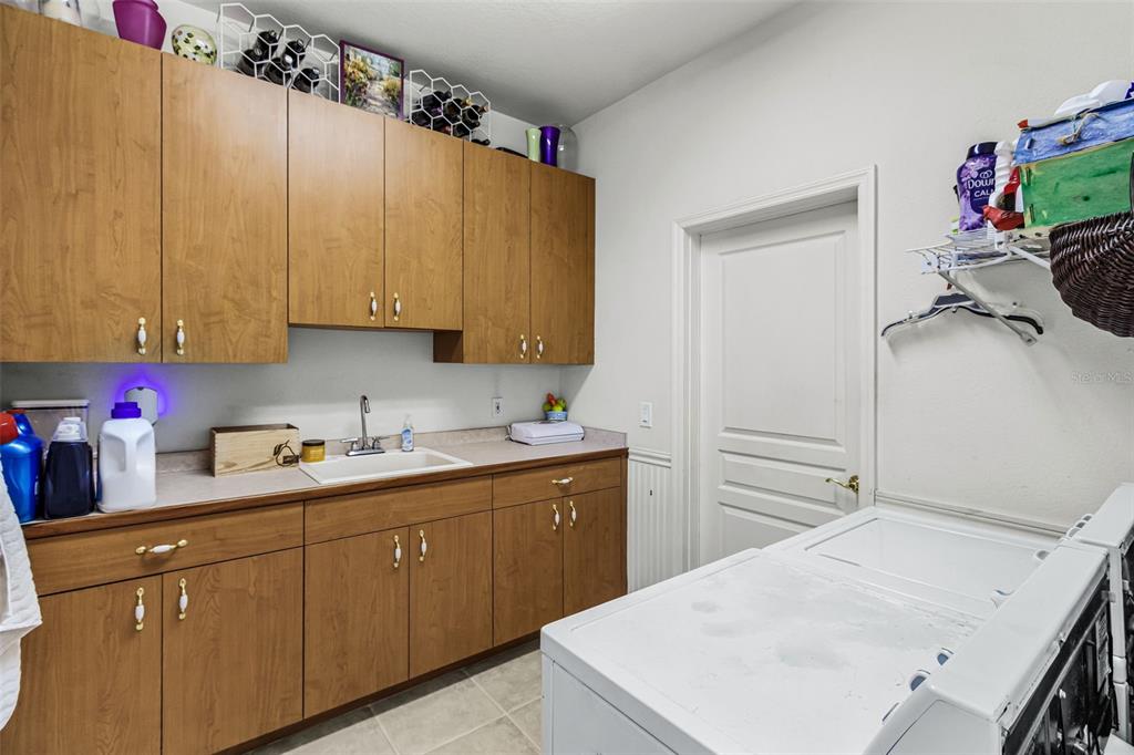 400 Gun Cay Lane Punta Gorda, FL 33950 - Photo 40 of 50 a kitchen with a sink dishwasher and cabinets