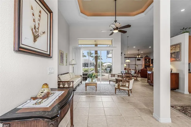 a living room with furniture and a floor to ceiling window