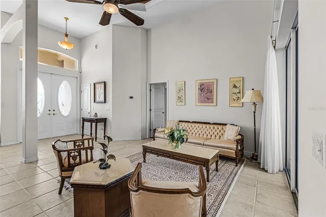 a dining room with furniture a chandelier and a rug