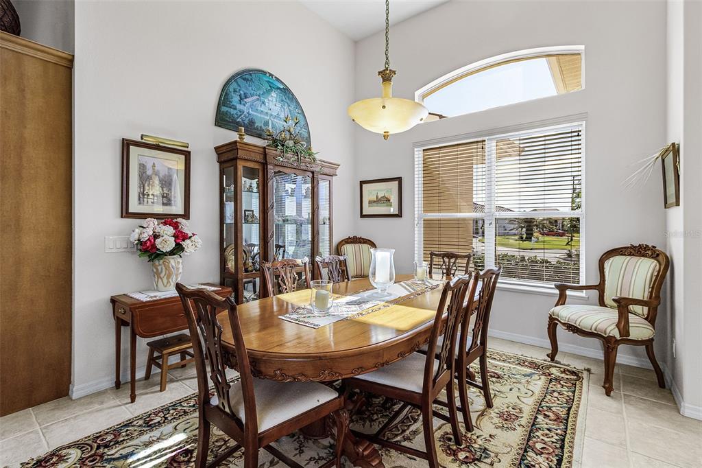400 Gun Cay Lane Punta Gorda, FL 33950 - Photo 8 of 50 a dining room with furniture a chandelier and a rug