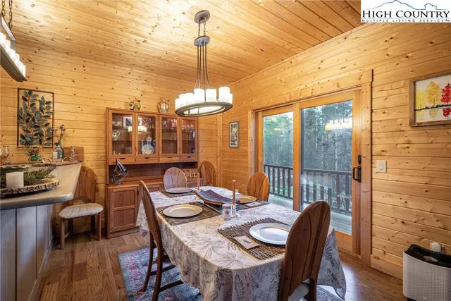 a view of a chairs and table in the balcony