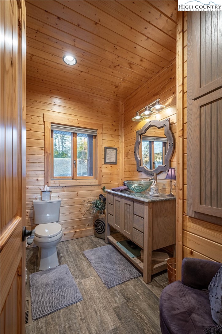 1989 Johns Ridge Parkway Lenoir, NC 28645 - Photo 17 of 50 a bathroom with a granite countertop toilet sink and mirror