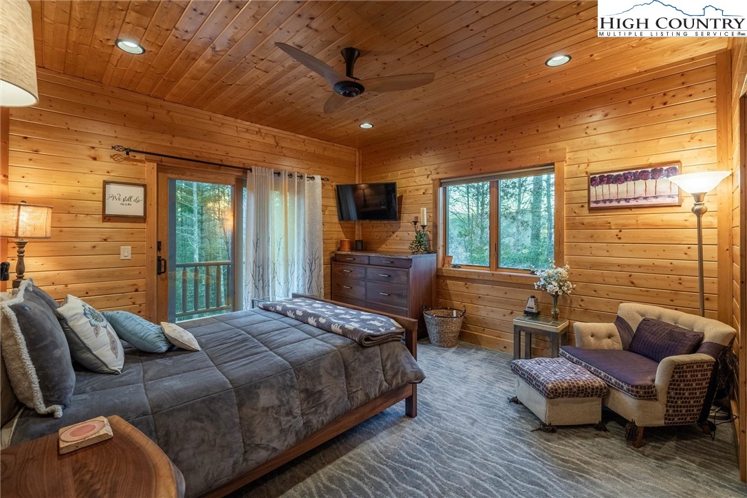 1989 Johns Ridge Parkway Lenoir, NC 28645 - Photo 18 of 50 a spacious bedroom with a bed and wooden floor