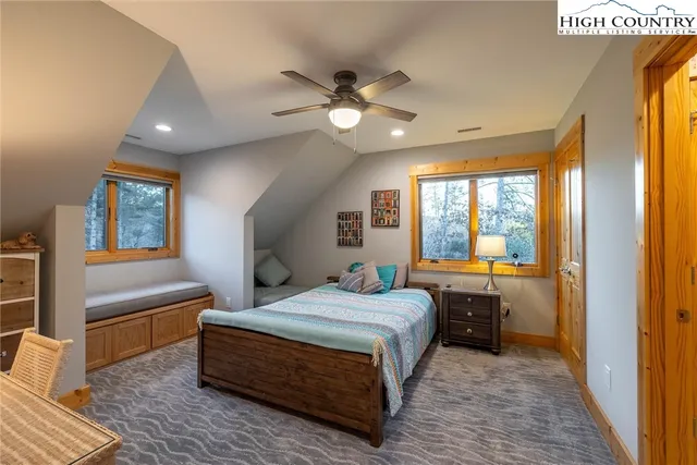 a spacious bathroom with a granite countertop tub and a large mirror