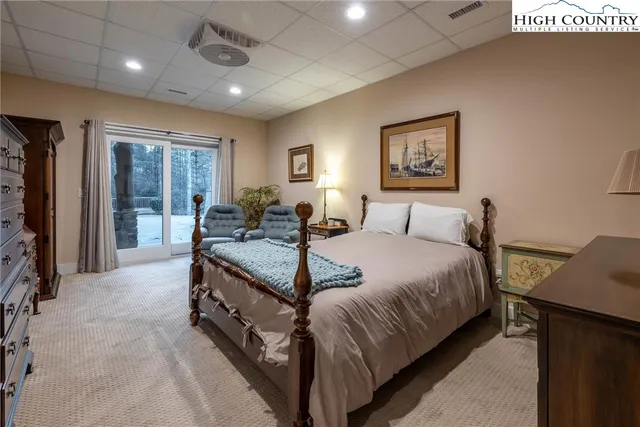 a en suite bathroom with a double vanity sink and a mirror