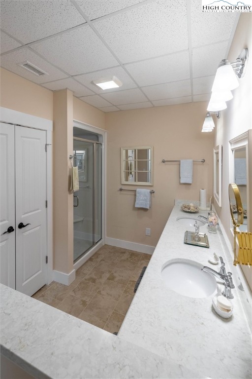 1989 Johns Ridge Parkway Lenoir, NC 28645 - Photo 27 of 50 a en suite bathroom with a double vanity sink and a mirror