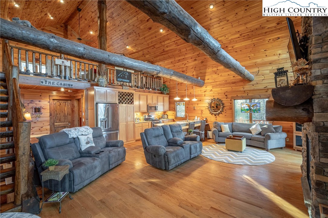 1989 Johns Ridge Parkway Lenoir, NC 28645 - Photo 30 of 50 a living room with furniture and a flat screen tv