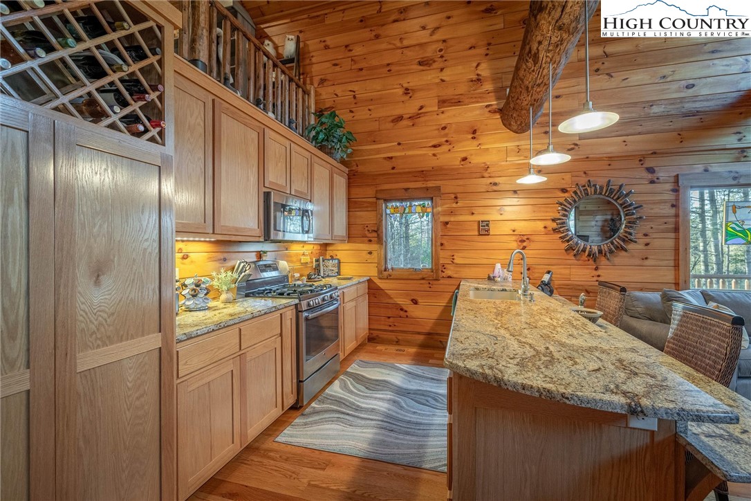 1989 Johns Ridge Parkway Lenoir, NC 28645 - Photo 32 of 50 a kitchen with stainless steel appliances granite countertop a sink and cabinets