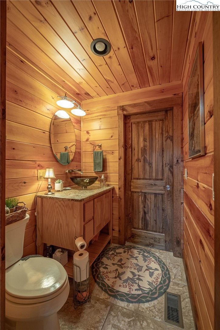 1989 Johns Ridge Parkway Lenoir, NC 28645 - Photo 34 of 50 a bathroom with a sink a toilet and shower