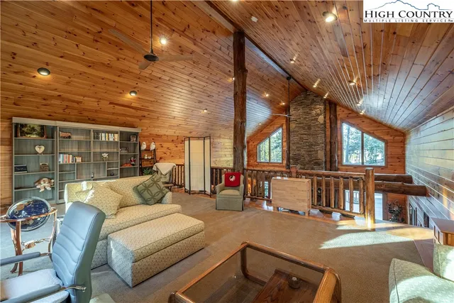 a bedroom with a bed and a chair