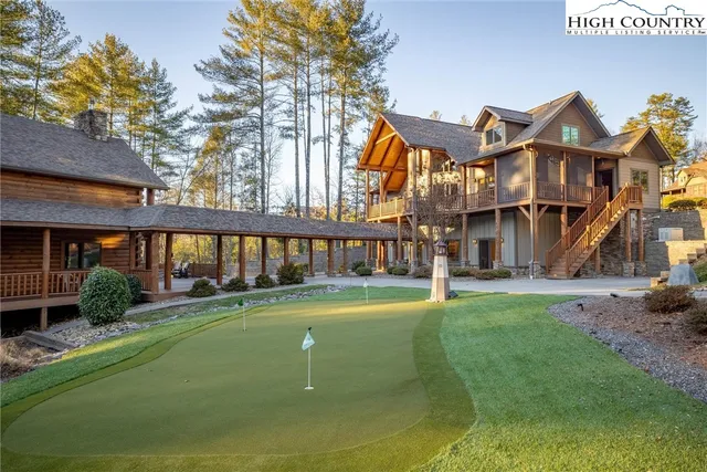 a view of a swimming pool and a yard