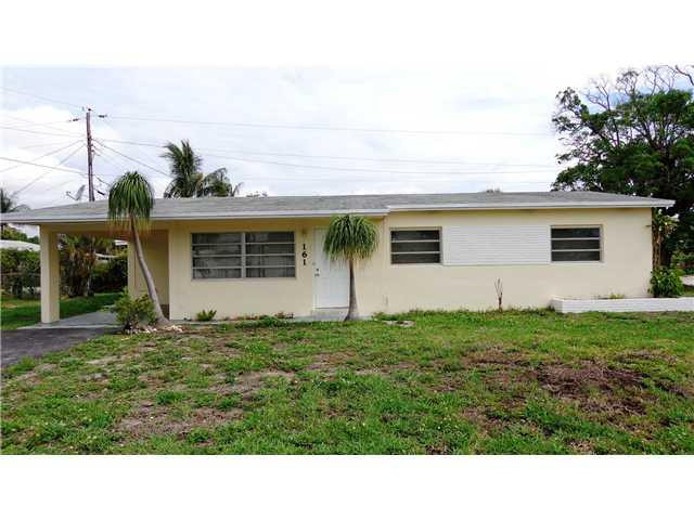 161 Northeast 20th Street Pompano Beach, FL 33060 - Photo 1 of 10 a black and white photo of a house