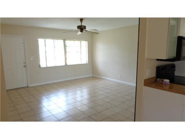 161 Northeast 20th Street Pompano Beach, FL 33060 - Photo 3 of 10 a black and white photo of a living room
