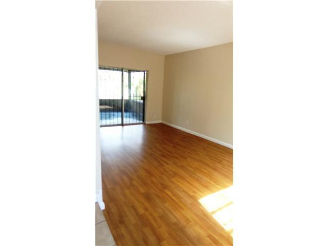 161 Northeast 20th Street Pompano Beach, FL 33060 - Photo 6 of 10 a view of an empty room with wooden floor