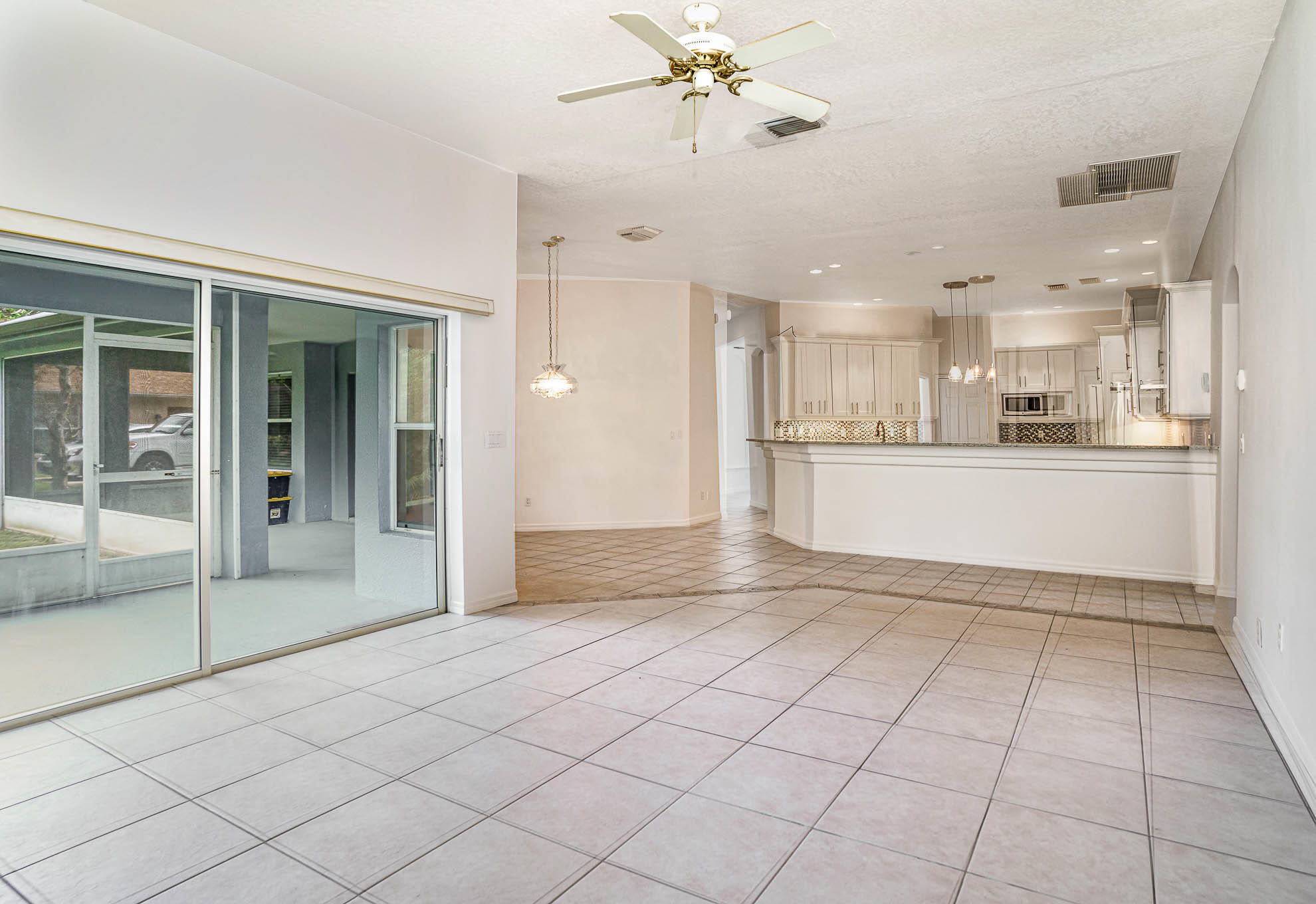 4353 Long Lake Road Melbourne, FL 32934 - Photo 17 of 35 Family Room with Pock Sliders