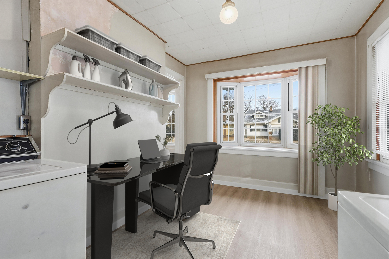 2748 12th Avenue Moline, IL 61265 - Photo 6 of 35 a view of a workspace with furniture and a window