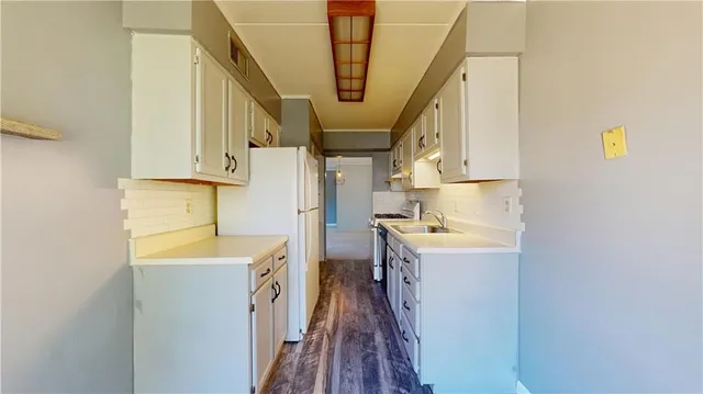 a bathroom with a sink a bathtub and dryer