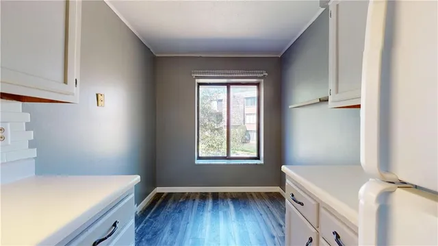 a room with window and wooden floor