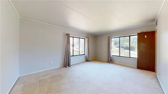 an empty room with windows