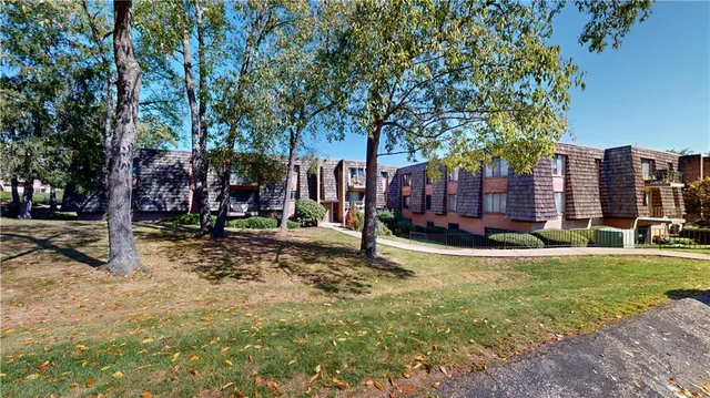a view of a fountain in front of a house