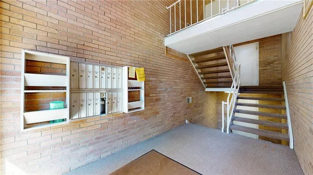 a view of entryway with a front door