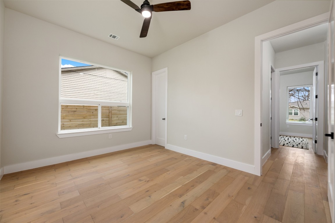 1004 Karen Avenue Austin, TX 78757 - Photo 11 of 29 wooden floor in an empty room with a window