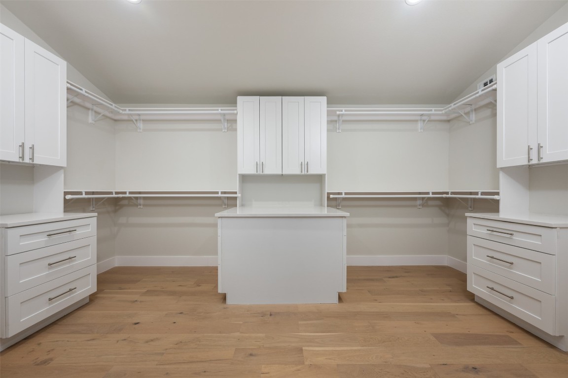 1004 Karen Avenue Austin, TX 78757 - Photo 16 of 29 a kitchen with white cabinets and a refrigerator