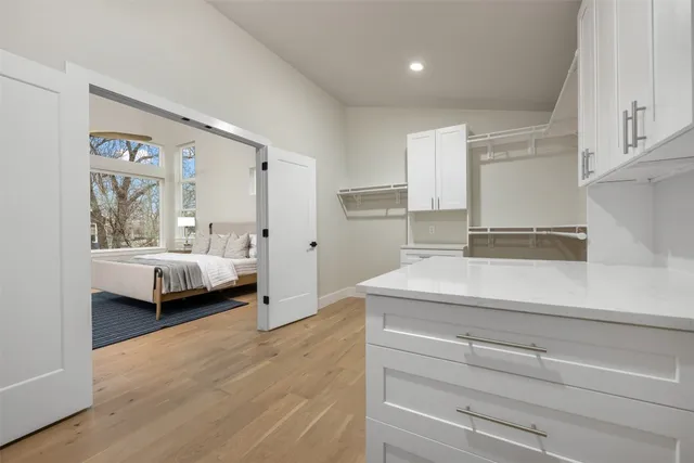 a spacious bathroom with a double vanity sink and mirror