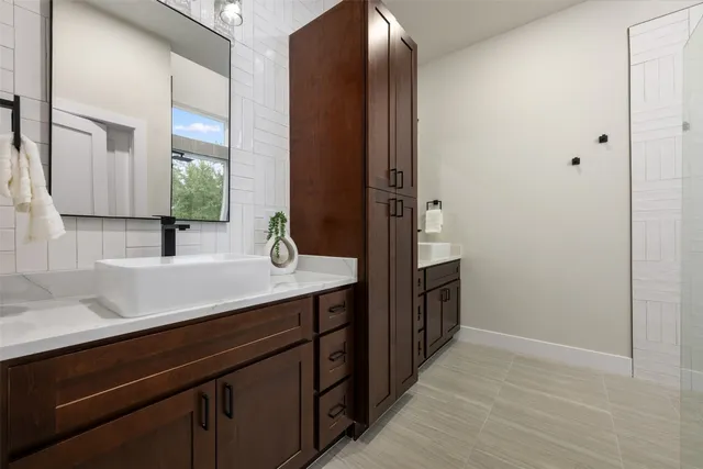 a bathroom with a sink and a mirror