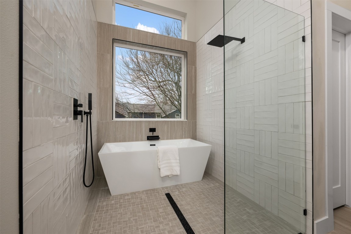 1004 Karen Avenue Austin, TX 78757 - Photo 21 of 29 a bathroom with a bathtub and a shower