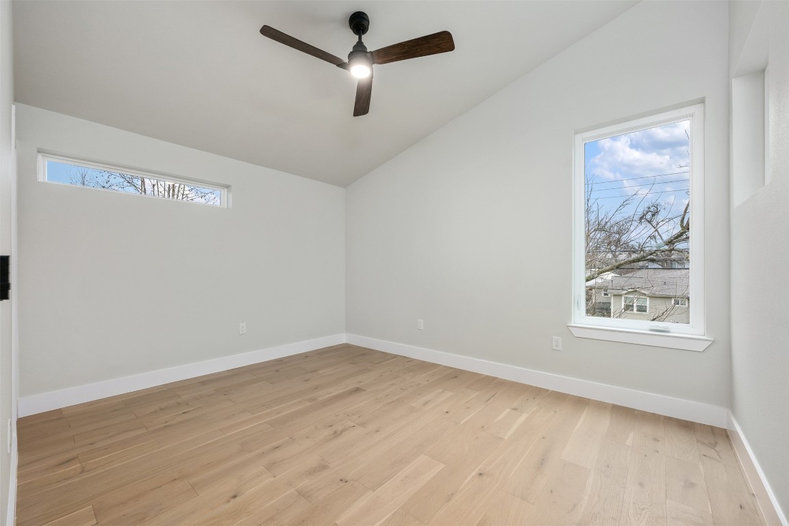 1004 Karen Avenue Austin, TX 78757 - Photo 22 of 29 an empty room with wooden floor and window