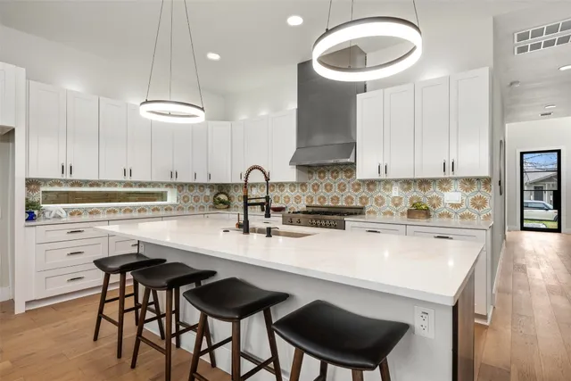 a kitchen with a sink cabinets and window