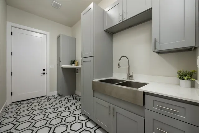 a kitchen with a sink and cabinets