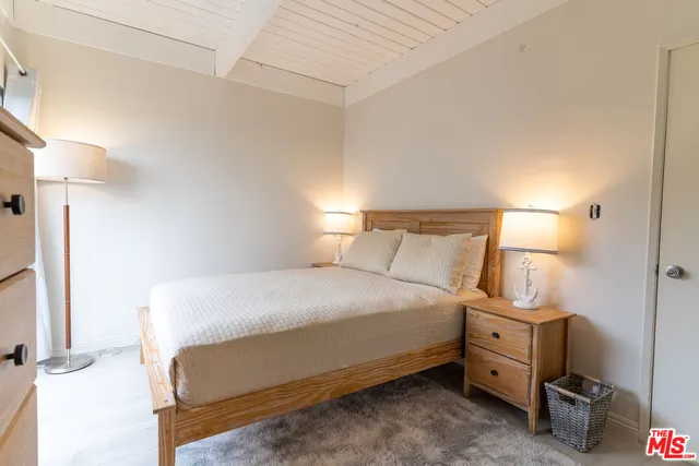 a bedroom with a bed and a cabinets